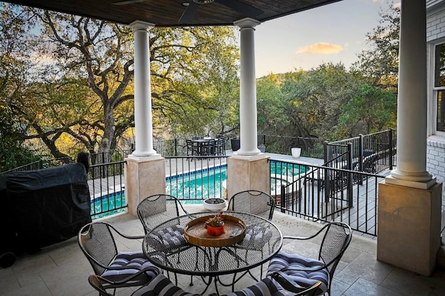 4119 Hidden Canyon Cv, Austin, TX 78746 - view of patio / terrace with a ceiling fan, view of scattered trees, outdoor dining area, and grilling area