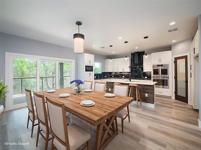 3013 Clark Ave, Lago Vista, TX 78645 - dining space with light wood-style floors and recessed lighting