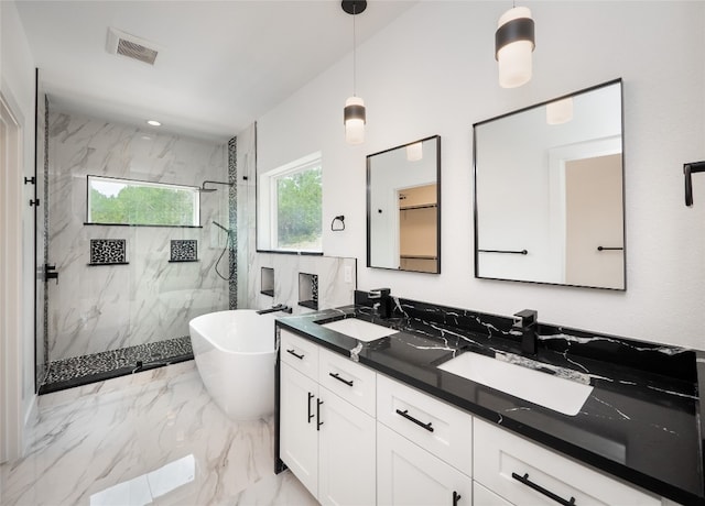 3013 Clark Ave, Lago Vista, TX 78645 - full bathroom featuring a marble finish shower, double vanity, a soaking tub, and marble tiled flooring