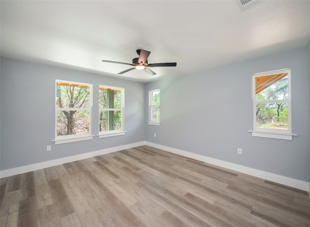 3013 Clark Ave, Lago Vista, TX 78645 - spare room with plenty of natural light, ceiling fan, and wood finished floors