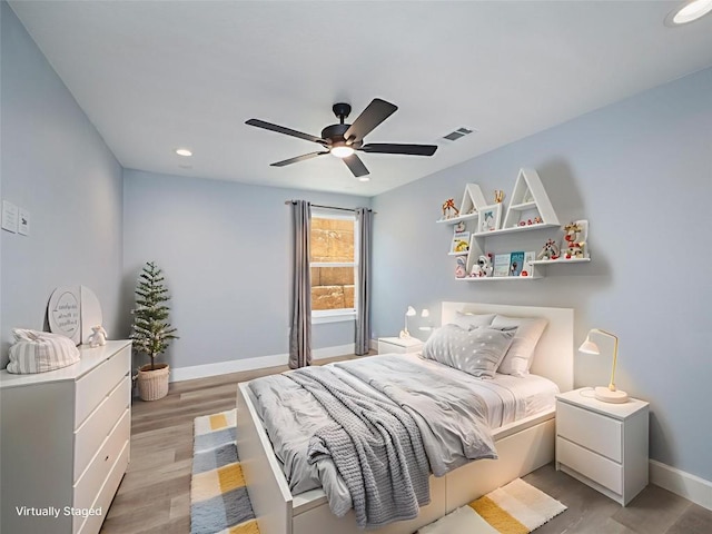 3013 Clark Ave, Lago Vista, TX 78645 - bedroom with light wood-type flooring, recessed lighting, and ceiling fan