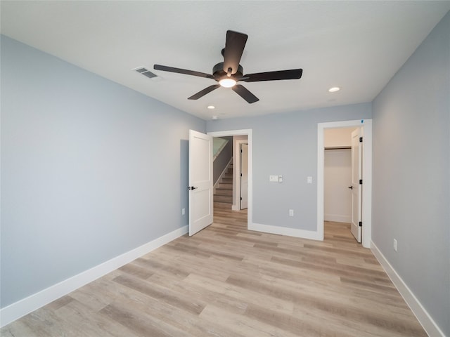 3013 Clark Ave, Lago Vista, TX 78645 - unfurnished bedroom with recessed lighting, light wood-style flooring, a spacious closet, and a ceiling fan