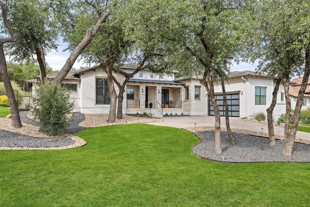 209 Ringtail Stream Dr, Lakeway, TX 78738 - back of house with a porch, stucco siding, concrete driveway, and an attached garage