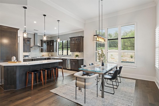 209 Ringtail Stream Dr, Lakeway, TX 78738 - dining room with dark wood-type flooring, ornamental molding, and wine cooler