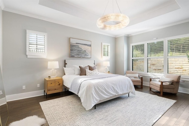 209 Ringtail Stream Dr, Lakeway, TX 78738 - bedroom featuring a raised ceiling, multiple windows, ornamental molding, and wood finished floors
