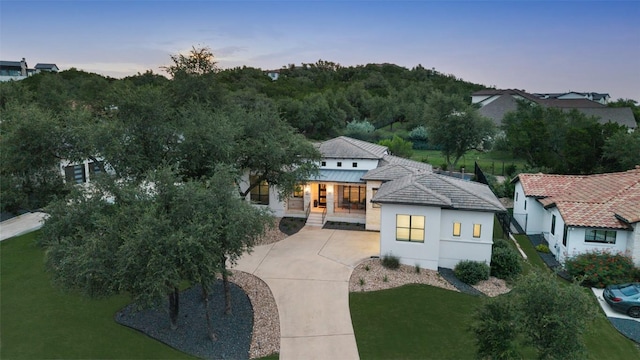 209 Ringtail Stream Dr, Lakeway, TX 78738 - view of front of home with covered porch, a lawn, and stucco siding