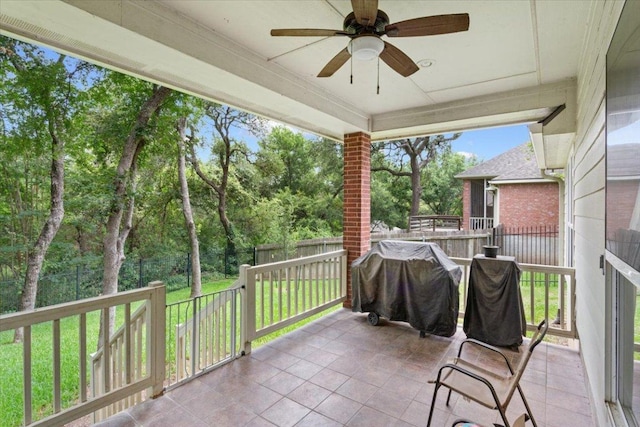 2802 Amber Forest Trl, Belton, TX 76513 - fenced backyard featuring grilling area, ceiling fan, view of scattered trees, and a patio area