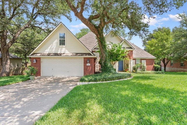 2802 Amber Forest Trl, Belton, TX 76513 - traditional-style house with brick siding, a front lawn, and driveway