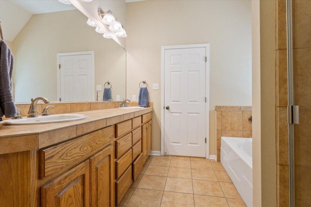 2802 Amber Forest Trl, Belton, TX 76513 - bathroom featuring double vanity, a garden tub, and tile patterned floors