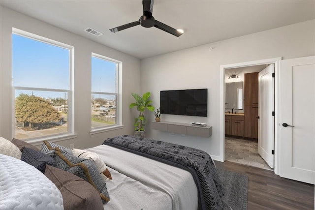 4510 Terry-O Ln Unit 322, Austin, TX 78745 - bedroom with wood finished floors, ensuite bathroom, and a ceiling fan