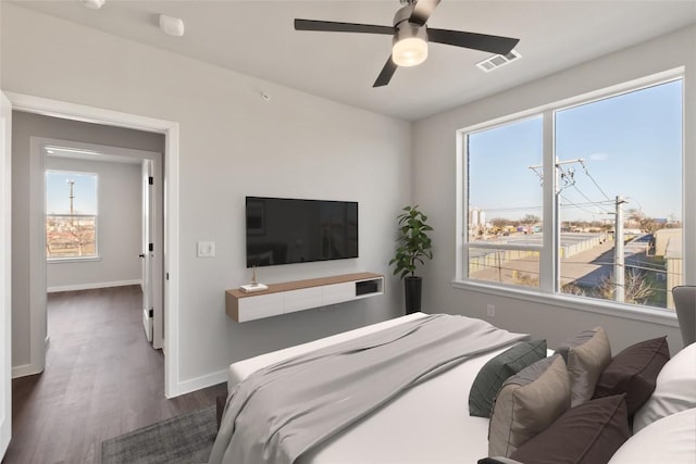 4510 Terry-O Ln Unit 322, Austin, TX 78745 - bedroom featuring dark wood-style flooring and ceiling fan
