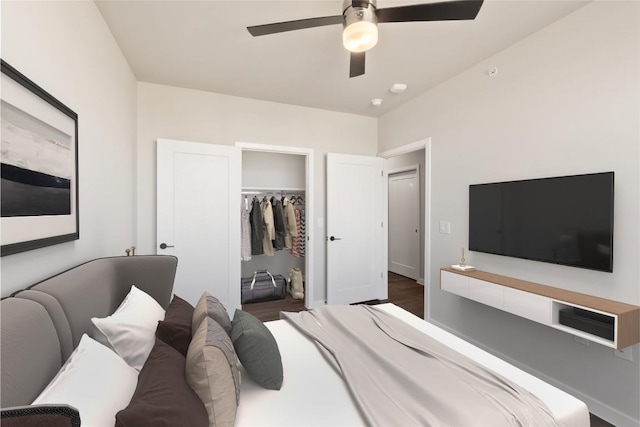 4510 Terry-O Ln Unit 322, Austin, TX 78745 - bedroom featuring ceiling fan, a walk in closet, and wood finished floors