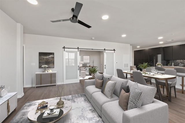 4510 Terry-O Ln Unit 322, Austin, TX 78745 - living area with a barn door, ceiling fan, recessed lighting, and wood finished floors