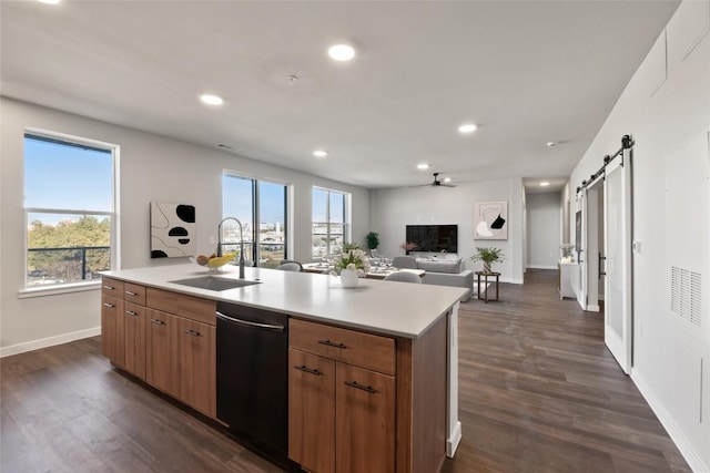 4510 Terry-O Ln Unit 322, Austin, TX 78745 - kitchen featuring dishwasher, a barn door, light countertops, open floor plan, and recessed lighting