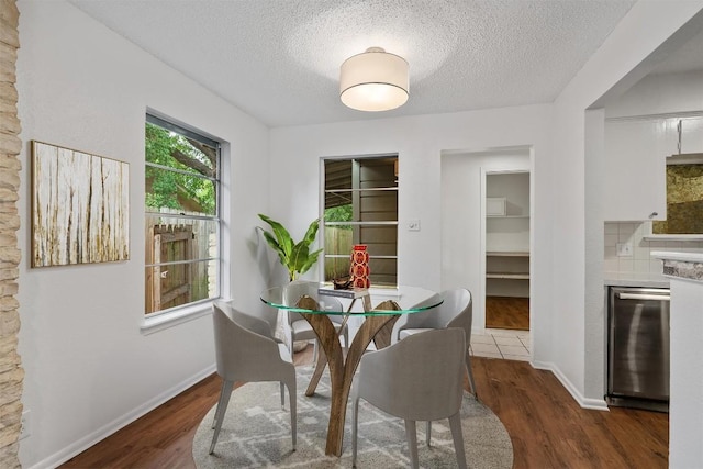 2616 Audubon Pl, Austin, TX 78741 - dining space with a textured ceiling and wood finished floors