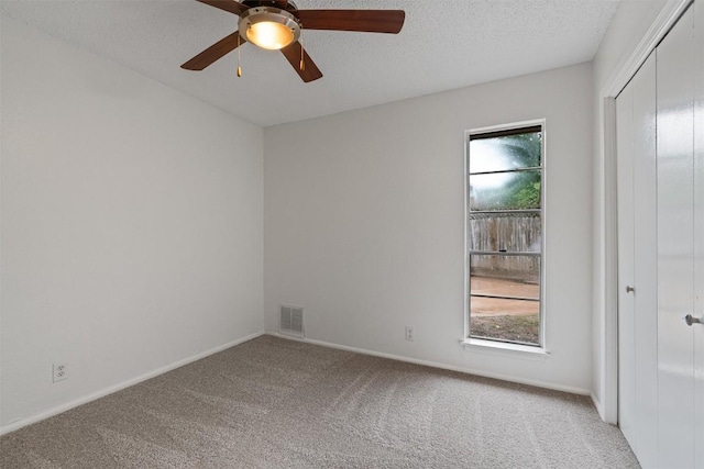 2616 Audubon Pl, Austin, TX 78741 - unfurnished room with carpet flooring, ceiling fan, and a textured ceiling