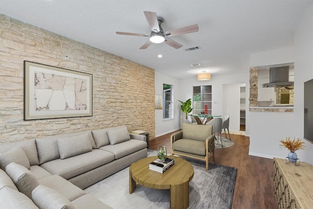 2616 Audubon Pl, Austin, TX 78741 - living area featuring ceiling fan, a textured ceiling, and wood finished floors
