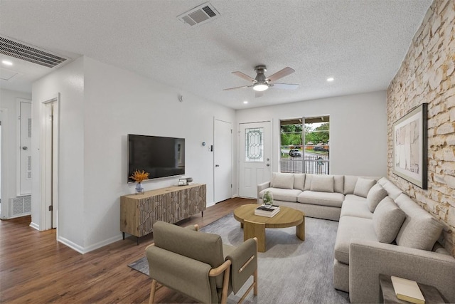 2616 Audubon Pl, Austin, TX 78741 - living area featuring wood finished floors, a ceiling fan, a textured ceiling, and recessed lighting