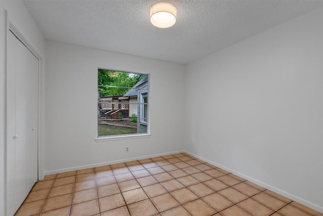 2616 Audubon Pl, Austin, TX 78741 - unfurnished bedroom featuring a textured ceiling and a closet