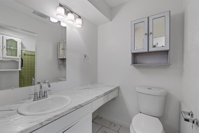 2616 Audubon Pl, Austin, TX 78741 - bathroom with marble look tile flooring and vanity
