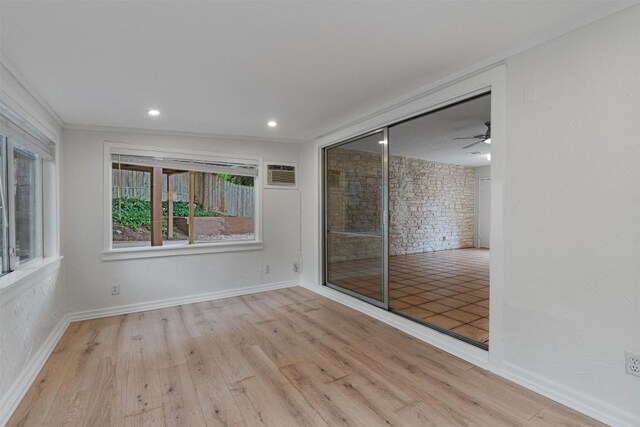 2616 Audubon Pl, Austin, TX 78741 - unfurnished room with wood finished floors, a ceiling fan, and recessed lighting