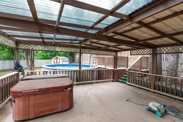 2616 Audubon Pl, Austin, TX 78741 - fenced backyard with a hot tub, a storage unit, and a patio area