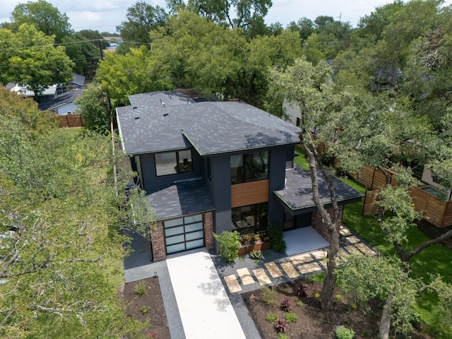 3005 French Pl, Austin, TX 78722 - view of front of home featuring a shingled roof, an attached garage, driveway, and brick siding