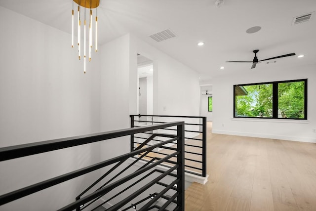 3005 French Pl, Austin, TX 78722 - corridor with an upstairs landing, light wood-style flooring, and recessed lighting