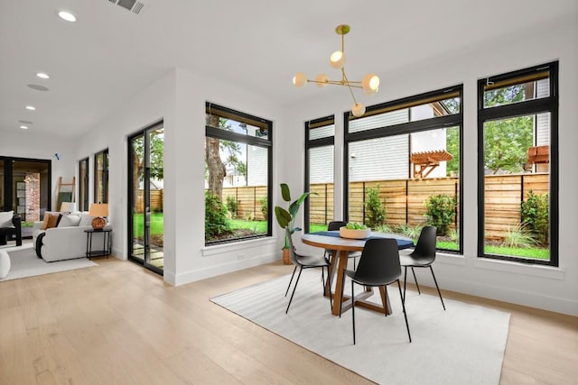 3005 French Pl, Austin, TX 78722 - sunroom featuring a chandelier