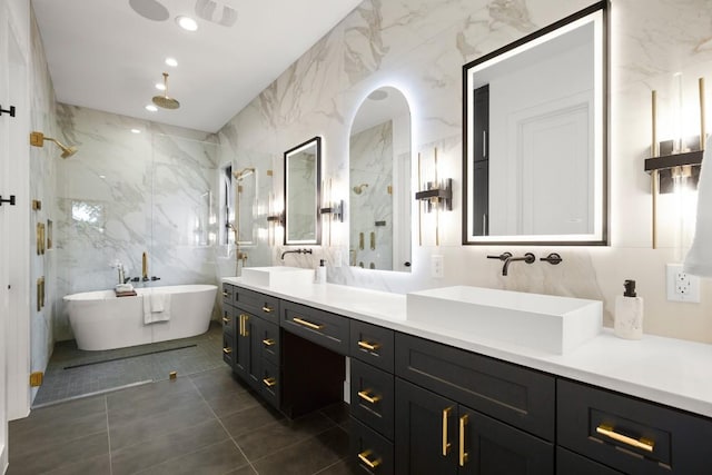 3005 French Pl, Austin, TX 78722 - bathroom featuring tile walls, a marble finish shower, double vanity, a freestanding bath, and tile patterned floors