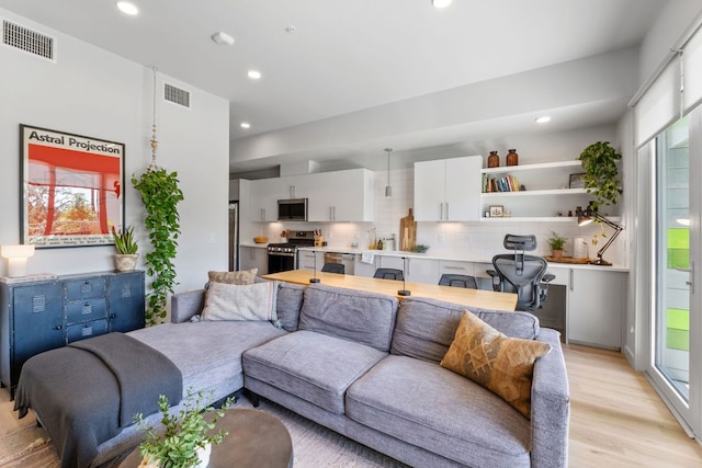 4004 Banister Ln Unit 105, Austin, TX 78704 - living room with light wood finished floors and recessed lighting
