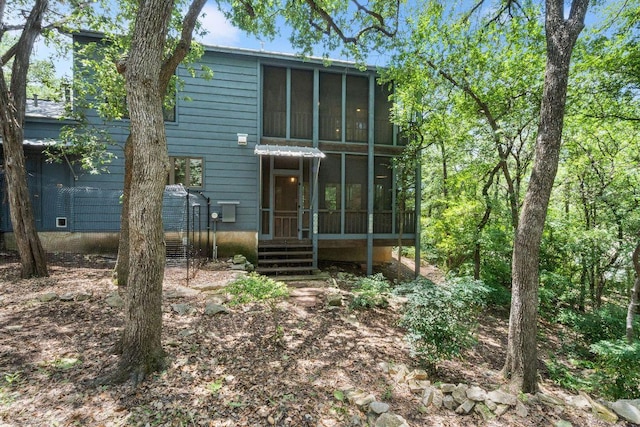 1703 Graywood Cv, Austin, TX 78704 - back of house featuring a sunroom