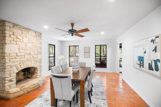 1703 Graywood Cv, Austin, TX 78704 - dining room with light tile patterned floors, a ceiling fan, recessed lighting, and a fireplace