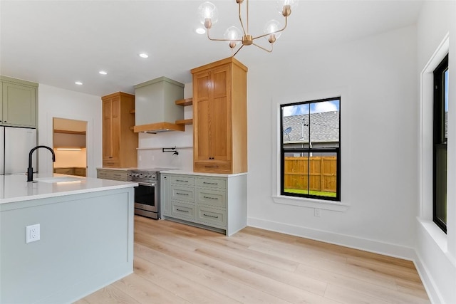 837 Birch Ln, Cottonwood Shores, TX 78657 - kitchen featuring stainless steel stove, custom exhaust hood, recessed lighting, light wood-style flooring, and open shelves