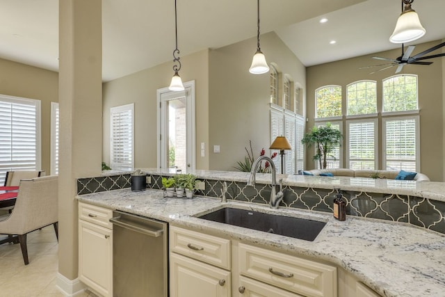 117 N Whitley Dr, Austin, TX 78738 - kitchen with stainless steel dishwasher, a ceiling fan, pendant lighting, light stone counters, and recessed lighting