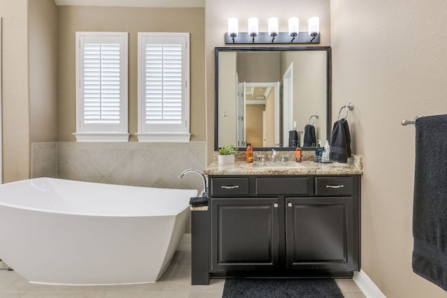 117 N Whitley Dr, Austin, TX 78738 - bathroom with a freestanding tub, vanity, and tile patterned flooring