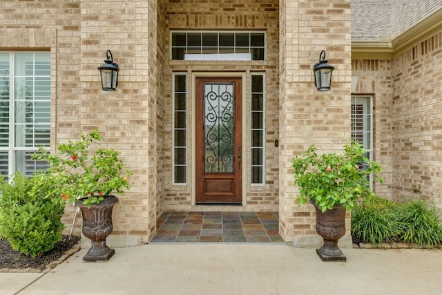 117 N Whitley Dr, Austin, TX 78738 - view of exterior entry with brick siding and roof with shingles