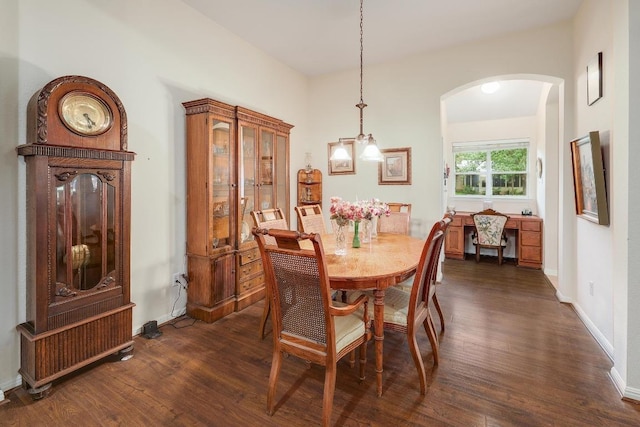 210 Buoy Cir, Georgetown, TX 78633 - dining space with arched walkways, dark wood-type flooring, and a chandelier