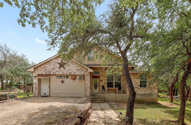 210 Buoy Cir, Georgetown, TX 78633 - view of front facade with brick siding and a garage