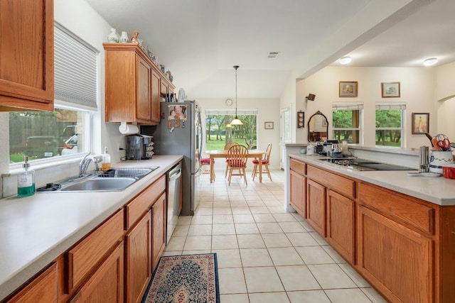 210 Buoy Cir, Georgetown, TX 78633 - kitchen featuring dishwasher, black electric cooktop, light tile patterned flooring, light countertops, and hanging light fixtures