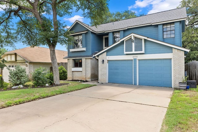 1102 Forest Oaks Path, Cedar Park, TX 78613 - traditional-style home with driveway, brick siding, an attached garage, and a shingled roof