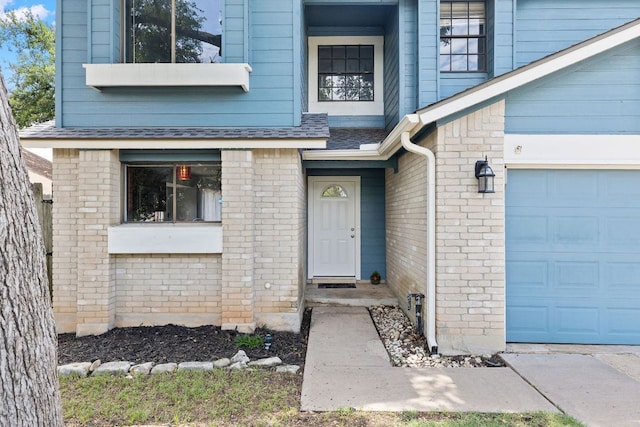 1102 Forest Oaks Path, Cedar Park, TX 78613 - doorway to property with a garage, roof with shingles, and brick siding
