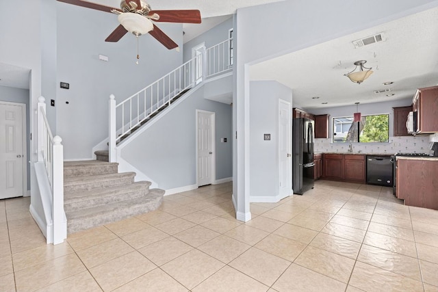 1102 Forest Oaks Path, Cedar Park, TX 78613 - kitchen featuring black appliances, a ceiling fan, light countertops, tasteful backsplash, and light tile patterned floors