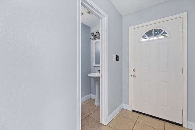 1102 Forest Oaks Path, Cedar Park, TX 78613 - entrance foyer featuring light tile patterned floors and a textured ceiling