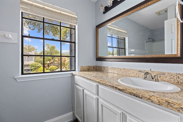 1102 Forest Oaks Path, Cedar Park, TX 78613 - full bathroom featuring plenty of natural light, vanity, a shower, and a textured wall