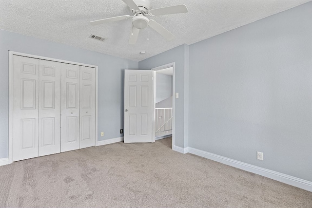 1102 Forest Oaks Path, Cedar Park, TX 78613 - unfurnished bedroom with carpet floors, a textured ceiling, a closet, and ceiling fan