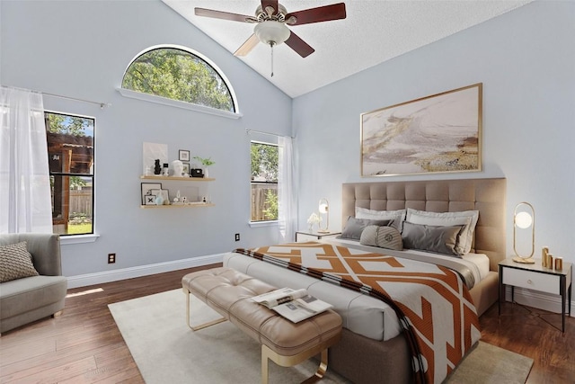 1102 Forest Oaks Path, Cedar Park, TX 78613 - bedroom featuring wood finished floors, high vaulted ceiling, and ceiling fan