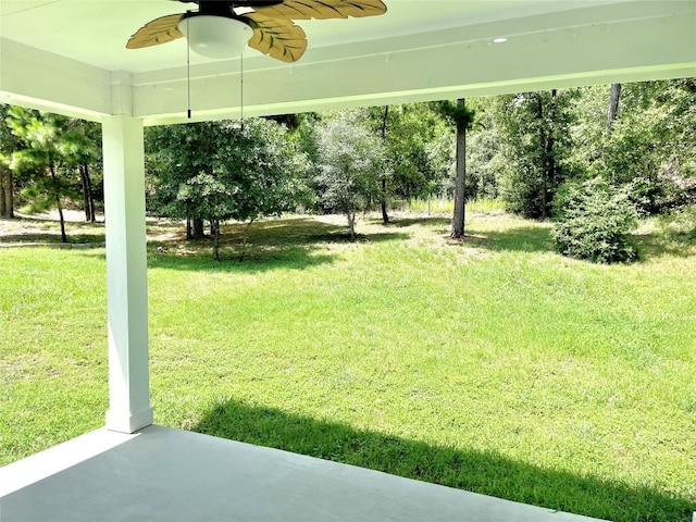 108 W Keamuku Ct, Bastrop, TX 78602 - view of grassy yard with ceiling fan and a patio