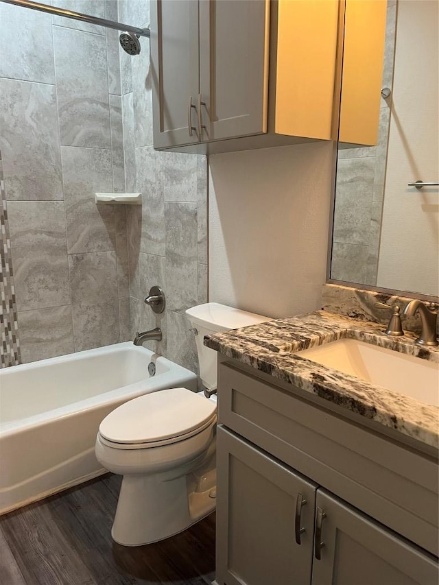 108 W Keamuku Ct, Bastrop, TX 78602 - full bathroom featuring vanity, wood finished floors, and tub / shower combination