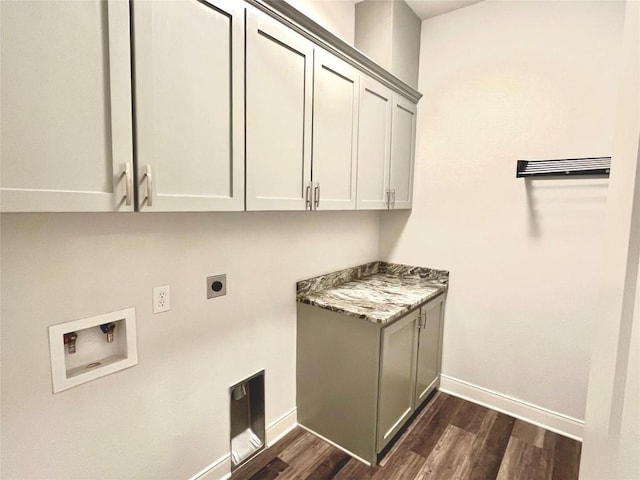 108 W Keamuku Ct, Bastrop, TX 78602 - laundry area featuring cabinet space, electric dryer hookup, washer hookup, and dark wood-style floors